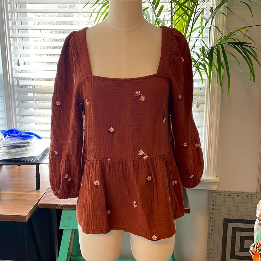 Embroidered peplum top